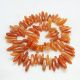 strand of red avnatrin beads 15-24 mm AK0442
